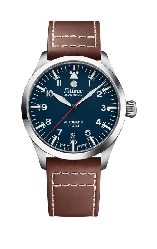 Tutima Flieger T5, reference 6109-03, glossy blue dial in a polished Grade 5 titanium case on a light brown Horween leather strap