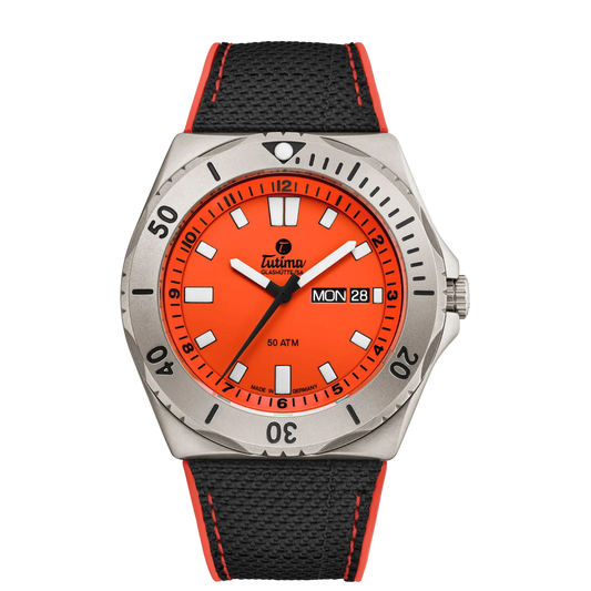 Tutima M2 Seven Seas, reference 6151-07, signal orange dial in a pearl-blasted titanium case on a black Kevlar strap with orange stitching