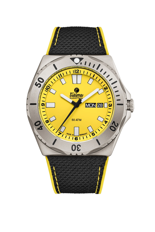 Tutima M2 Seven Seas, reference 6151-09, yellow dial in a pearl-blasted titanium case on a black Kevlar strap with yellow stitching