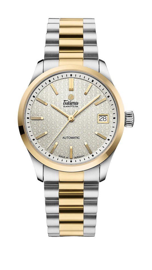 Tutima Lady Sky, reference 6705-22, white dial with gold coloured indexes under an 18 carat gold bezel on a bicolour bracelet
